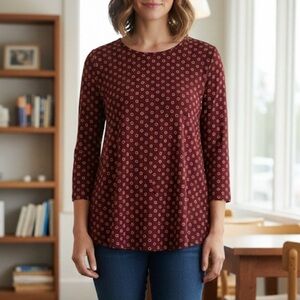 STUDIO B by Bobeau small white flowers and dots on a burgundy background.